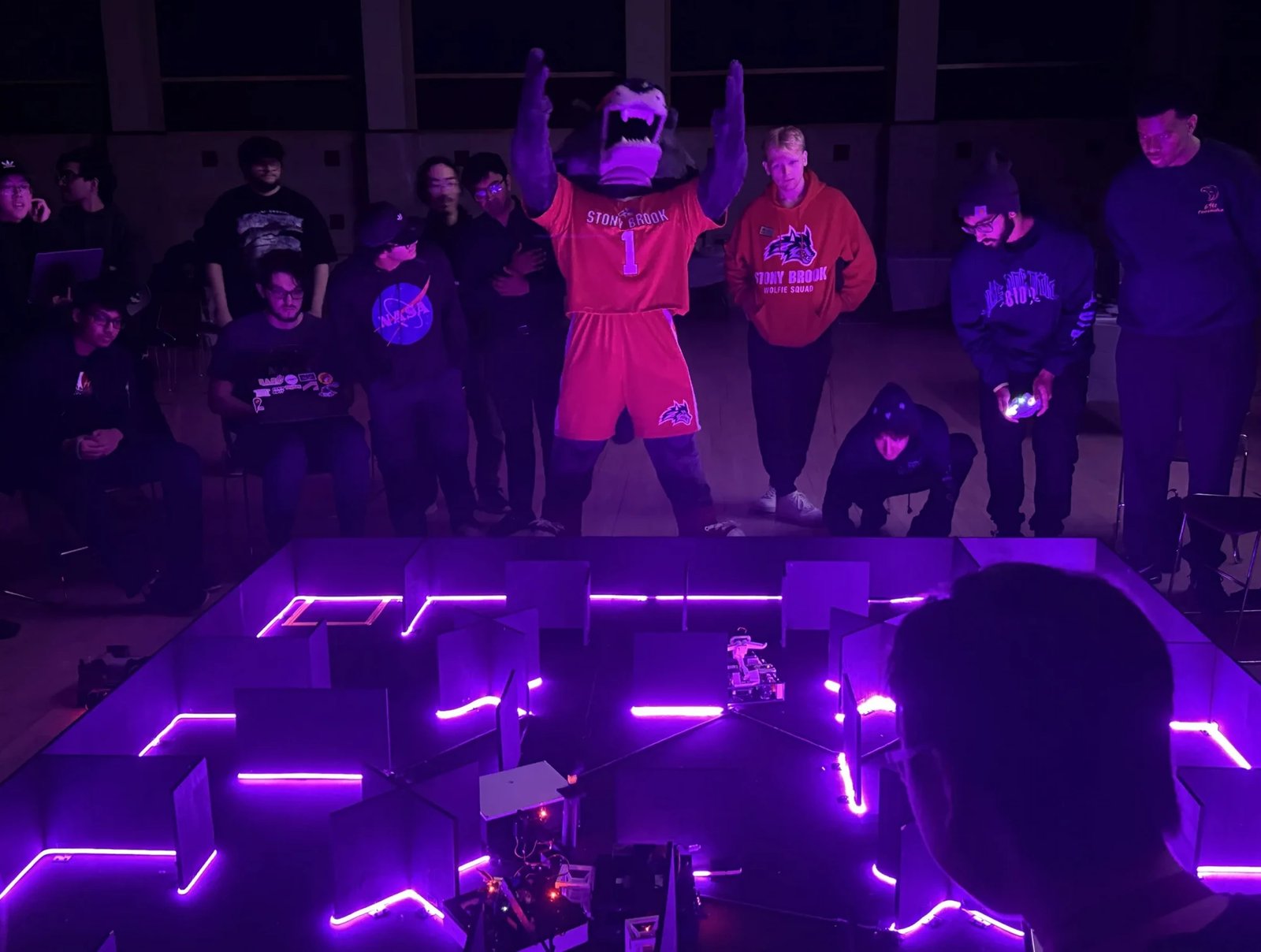 Wolfie hyping the crowd at the LED-lit Internal Competition arena